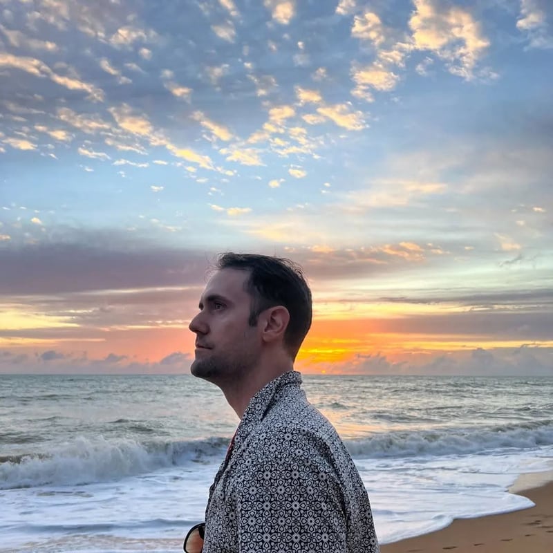 Derek watching the sunrise over the sea