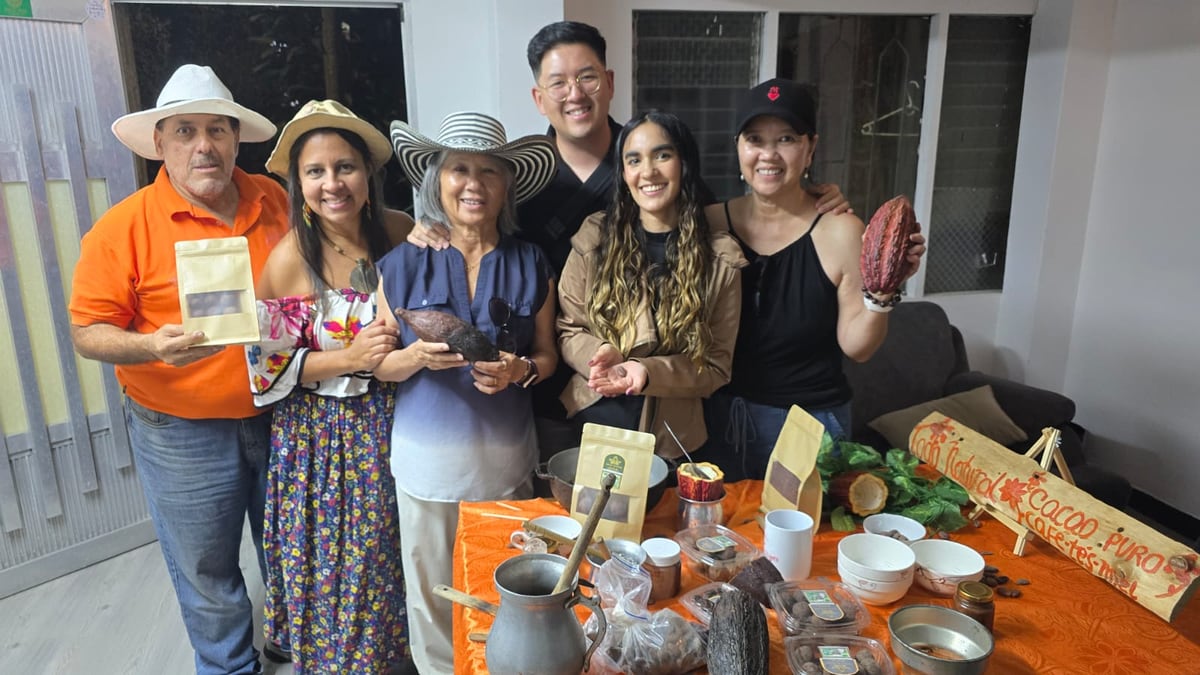 Guests and hosts gathered around the table at Belong Club's first cacao workshop in Medellín